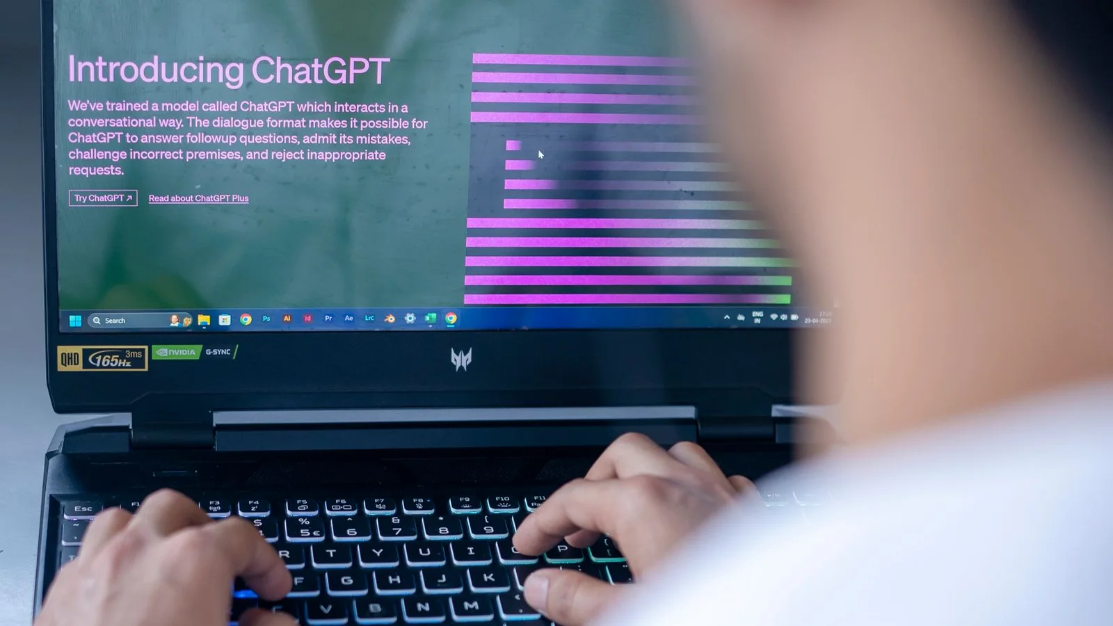 A person typing a request into an AI interface on a laptop