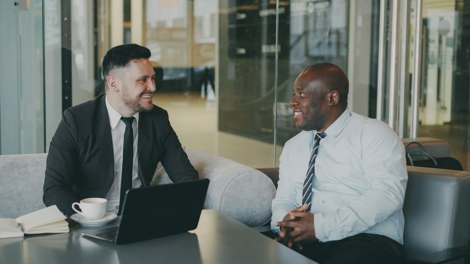 Two professionals meeting in a modern office
